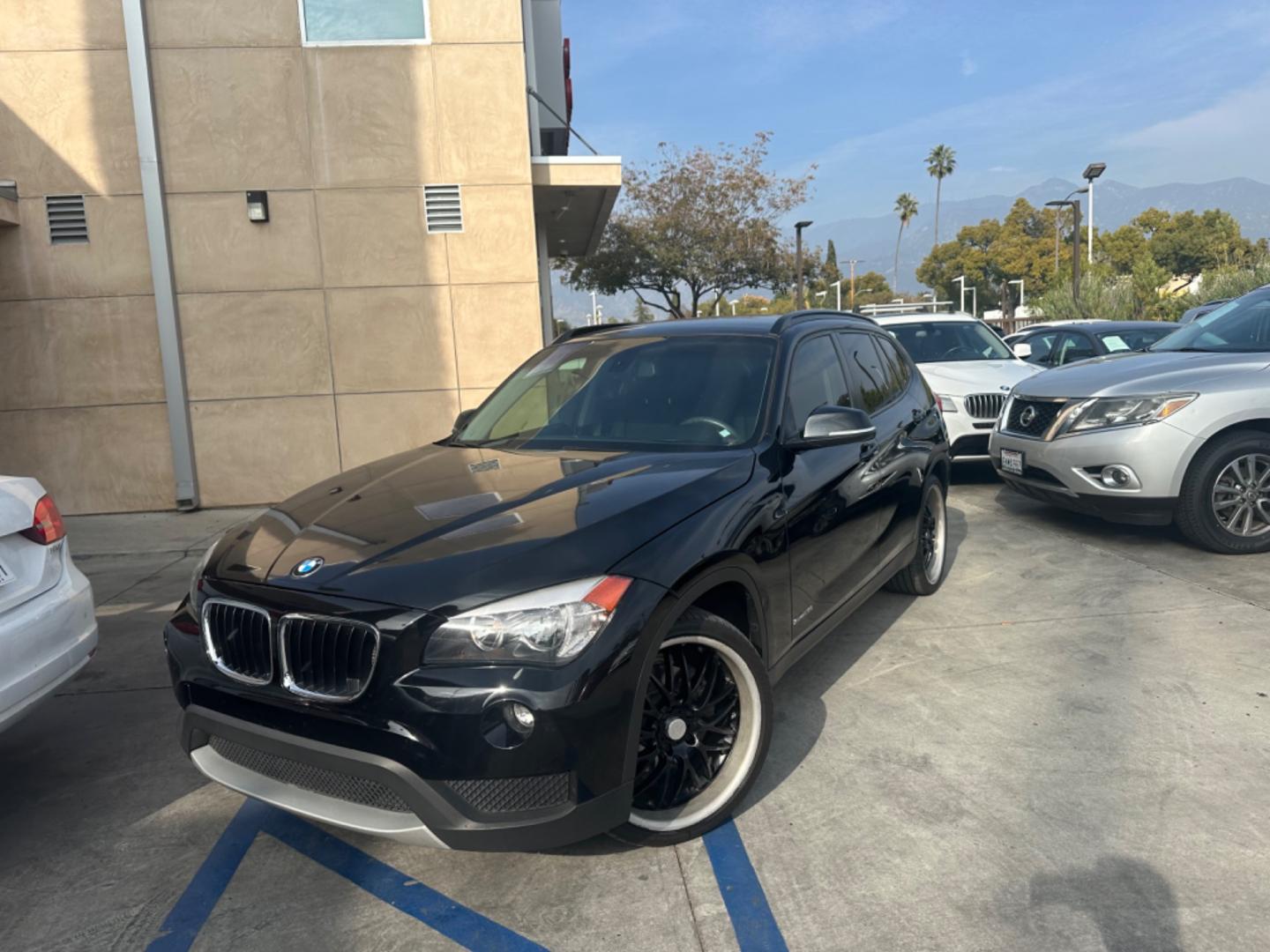 2014 Black /Black BMW X1 (WBAVM1C57EV) with an 4 CYLINDER engine, Automatic transmission, located at 30 S. Berkeley Avenue, Pasadena, CA, 91107, (626) 248-7567, 34.145447, -118.109398 - Photo#1